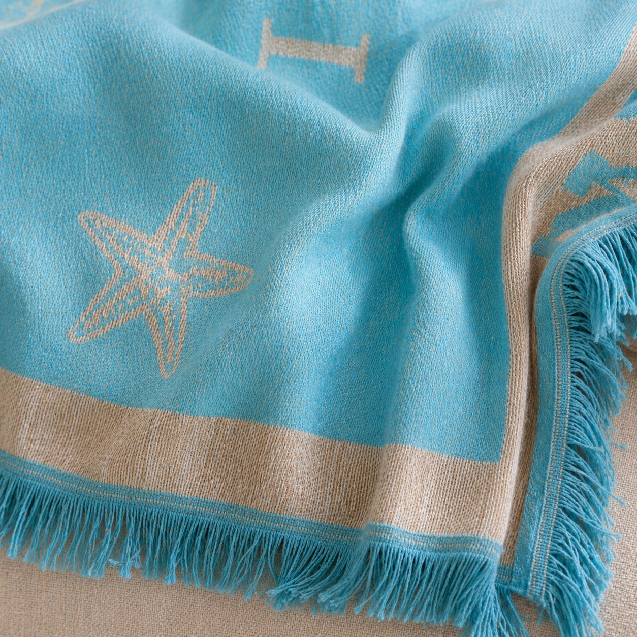 Detailaufnahme Jacquard-Struktur Decke Pad SEA Türkis
